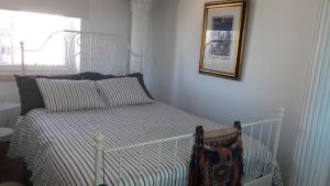 מיטה או מיטות בחדר ב-Sunrise Terrace Apartment