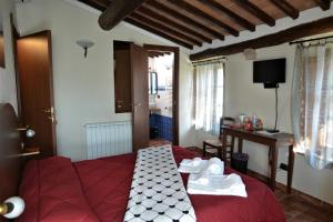 Postel nebo postele na pokoji v ubytování Il Pozzo Di Sant'Andrea