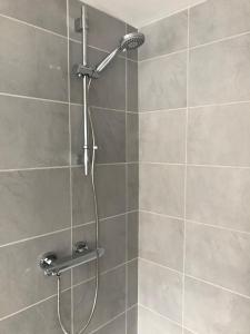 a shower with a shower head in a bathroom at Willow Dene in Scarborough +81 photos