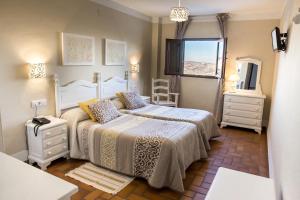 Posteľ alebo postele v izbe v ubytovaní Hotel Zuhayra