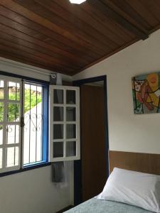 Tempat tidur dalam kamar di Viva Chico Rei Hostel