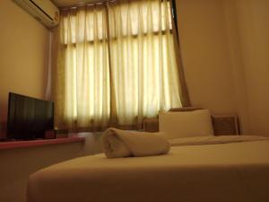 a hotel room with two beds and a window at is boutique huahin hotel in Hua Hin +40 photos