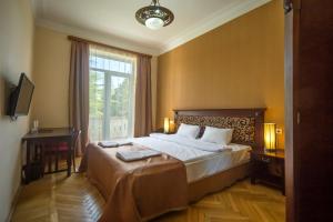 Voodi või voodid majutusasutuse Legends Tskaltubo Spa Resort toas