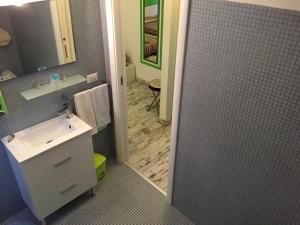 a bathroom with a shower with a sink and a mirror at B&B La Terrazza Sul Mare Taormina in Taormina