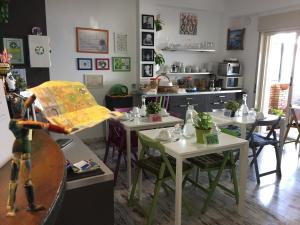 a kitchen with tables and chairs in a room at B&B La Terrazza Sul Mare Taormina in Taormina