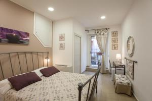 Postel nebo postele na pokoji v ubytování B&B Trio D'Archi - La Pilozza Infiorata
