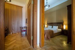 Voodi või voodid majutusasutuse Legends Tskaltubo Spa Resort toas