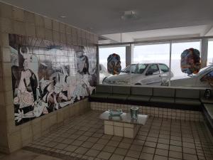 a bathroom with graffiti on the walls and a car at Apartamento de 3 quartos a 100 metros da Praia de Boa Viagem in Recife +29 photos