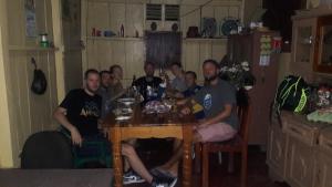 a group of people sitting around a table at Brunos Place in El Remate