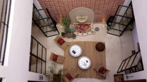 an overhead view of a room with a table and chairs at Riad la Source du Desert in Marrakesh