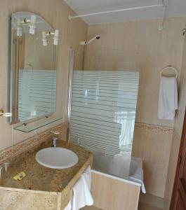 Koupelna v ubytování Hotel Albero