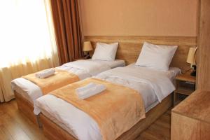 Postelja oz. postelje v sobi nastanitve Sunshine Kazbegi