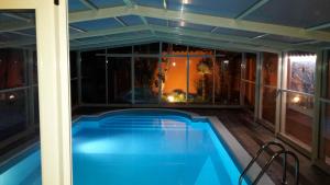 a swimming pool on the balcony of a house at Villa Salvatore in San Leone