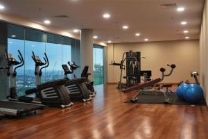 a gym with treadmills and exercise equipment in a building at Azure Residence Paradigm Mall in Petaling Jaya