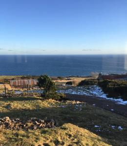a view of the ocean from the top of a hill at The Stroops in Helmsdale