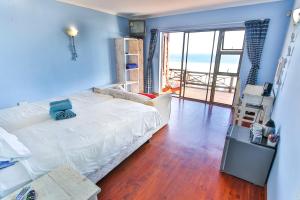 Ένα ή περισσότερα κρεβάτια σε δωμάτιο στο Oyster Bay Beach Lodge