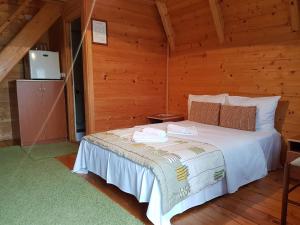 Postel nebo postele na pokoji v ubytování Aparthotel Koliba