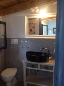 a bathroom with a sink and a toilet at Villa Giulia in Parghelia