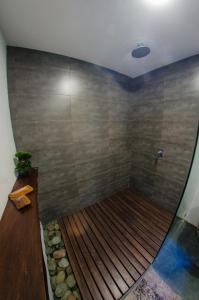 a bath tub with a wooden floor in a bathroom at Palaka Resort in General Luna +18 photos