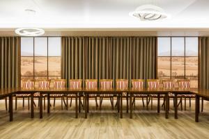 a conference room with a long table and chairs at Big Stone in Ukmergė