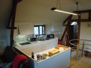 a kitchen with a counter top in a room at Polder 27 in Oudenburg