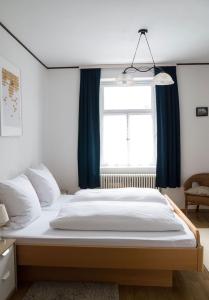 Ein Bett oder Betten in einem Zimmer der Unterkunft Hotel B&B Steinasäge
