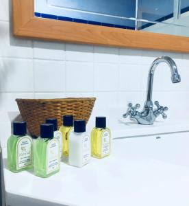 a group of four bottles of soap on a kitchen counter at Luz del Huécar in Cuenca