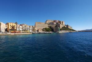 a view of a body of water with buildings at Casa ANNA in Calvi