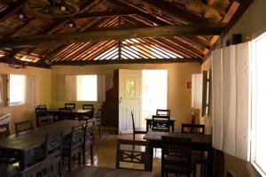 A restaurant or other place to eat at Hotel Pousada Recanto do Pai