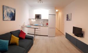 A kitchen or kitchenette at VV Canteras Sol y Playa