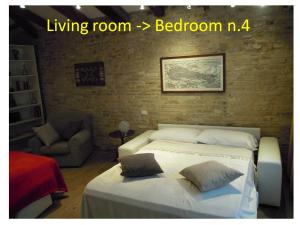 Postel nebo postele na pokoji v ubytování Ca' de l'Oca