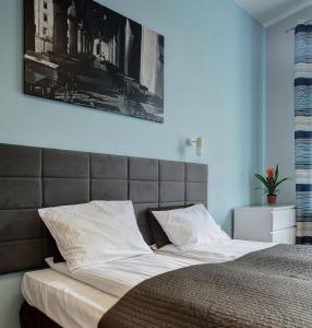 Postel nebo postele na pokoji v ubytování Grace Apartments