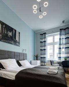 Postel nebo postele na pokoji v ubytování Grace Apartments