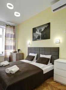 Postel nebo postele na pokoji v ubytování Grace Apartments