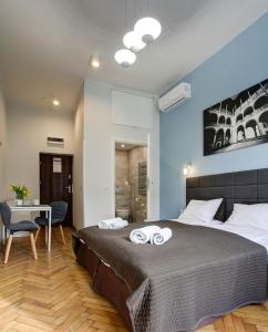Postel nebo postele na pokoji v ubytování Grace Apartments