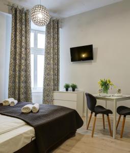 Postel nebo postele na pokoji v ubytování Grace Apartments