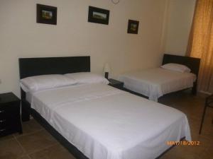 Cama o camas de una habitación en Hotel Paraíso Colonial