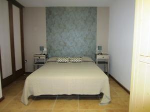 Ένα ή περισσότερα κρεβάτια σε δωμάτιο στο Casa Perenquén