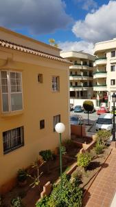 a view of a building with a parking lot at Apartamento Nerja Beach in Nerja