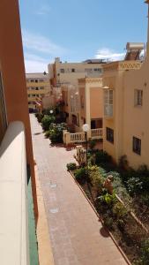 a view of a brick walkway in front of buildings at Apartamento Nerja Beach in Nerja