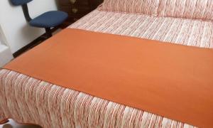 Postel nebo postele na pokoji v ubytování GHL casa hotel