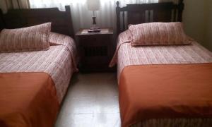 Postel nebo postele na pokoji v ubytování GHL casa hotel