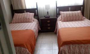Postel nebo postele na pokoji v ubytování GHL casa hotel