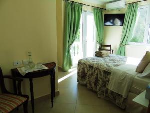 Ein Bett oder Betten in einem Zimmer der Unterkunft Taboga Palace SPA Hotel
