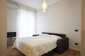 Posteľ alebo postele v izbe v ubytovaní Monolocale Fiera Milano City