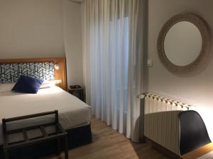 Posteľ alebo postele v izbe v ubytovaní Hotel Celanova