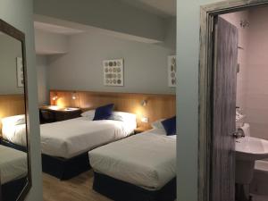 Posteľ alebo postele v izbe v ubytovaní Hotel Celanova