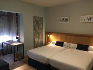 Posteľ alebo postele v izbe v ubytovaní Hotel Celanova