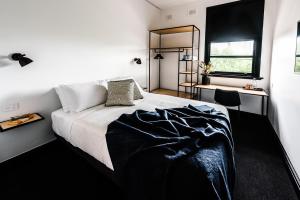 Postelja oz. postelje v sobi nastanitve Sydney Park Hotel