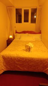 Postel nebo postele na pokoji v ubytování Hostal El Peregrino